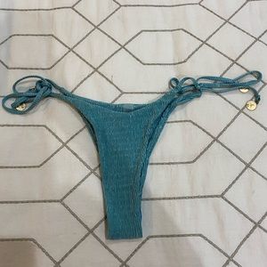teal bikini bottom with gold medallions on strings